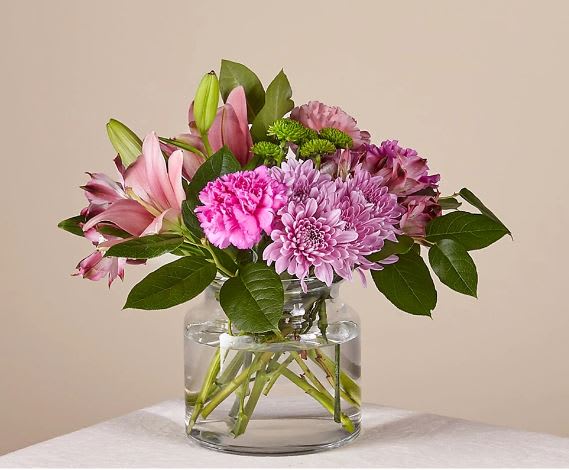 Mariposa Bouquet Mariposa Bouquet - Did you know that when a butterfly crosses your path, it's a sign of good luck? This bouquet offers a mix of ruffled texture, vibrant colors, and positivity to light up any room as soon as it arrives.