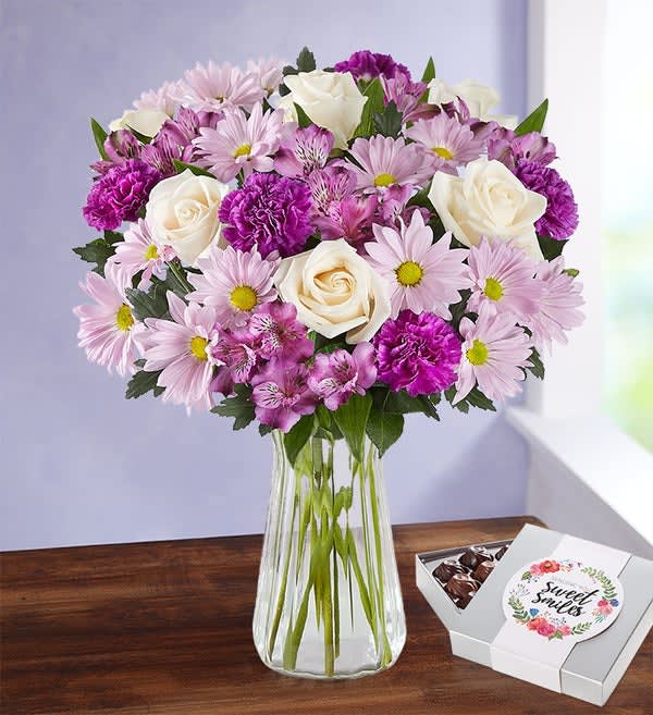 Lavender Garden Bouquet Lavender Garden Bouquet - Put a smile on the face of someone very special with our fresh-from-the-garden bouquet. Soothing shades of lavender and white come together to deliver your sentiments effortlessly.With box of chocolates. Upgrade to DELUXE and get purple vase. Premium Purple vase and box of 24 chocolates.
