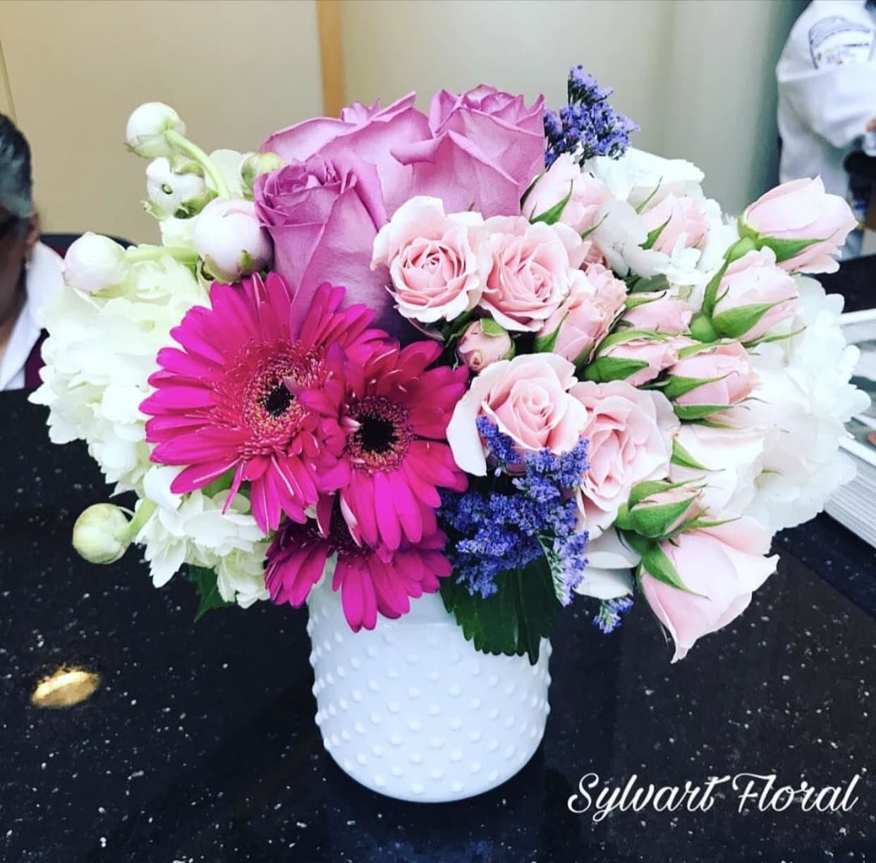 Something Cute and Fun! Something Cute and Fun! - Something cute and fun features roses, spray roses, hydrangeas and gerbera daisy in a white square vase. (Florals and container might vary due to availability.) Note: If you would like to change floral color, please add your request in the note section when placing your order.