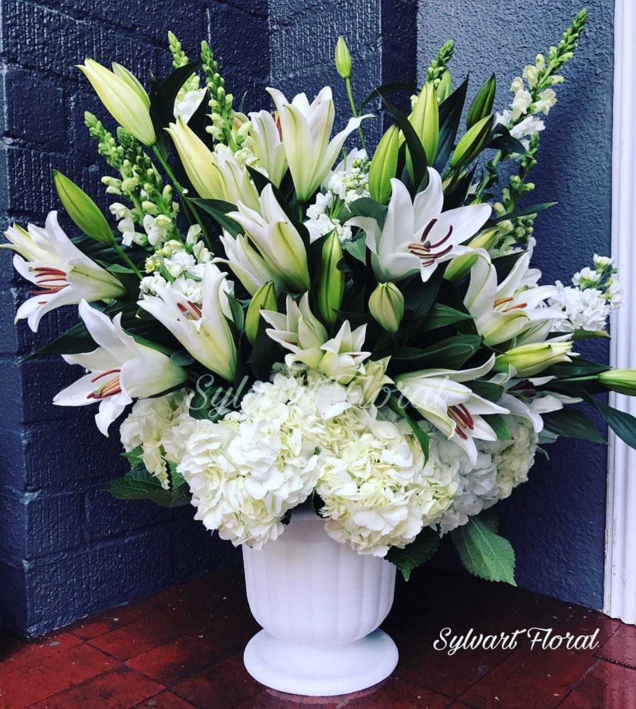 Pure - Pure is bold statement with this elegantly simple design. (Florals and container might vary due to availability.) Note: If you would like to change floral color, please add your request in the note section when placing your order. 