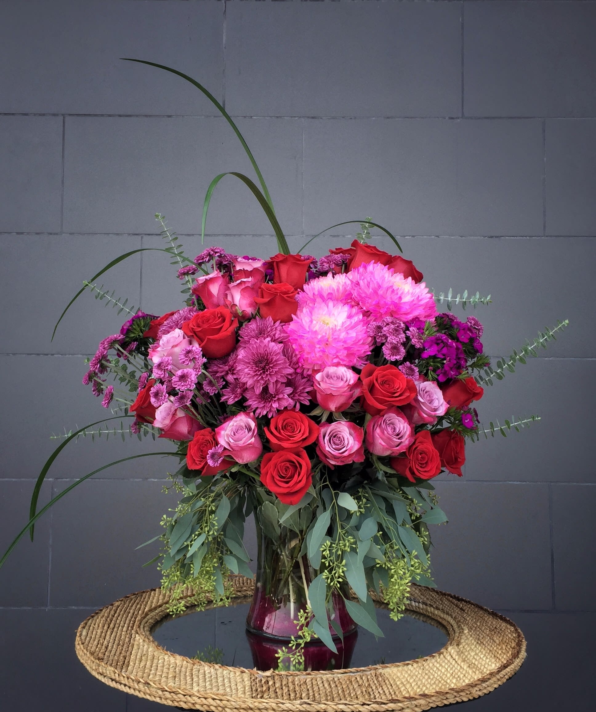 Romantic Maldives - Beautiful design including all premium fresh flowers: rose, sweet william, gebera... and accents in a tall glass vase.
