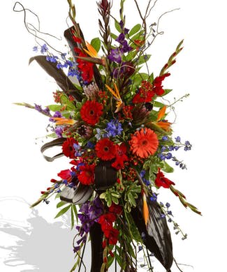 Tropical Easel Spray - Assorted Tropical fresh flowers designed on a standing spray.