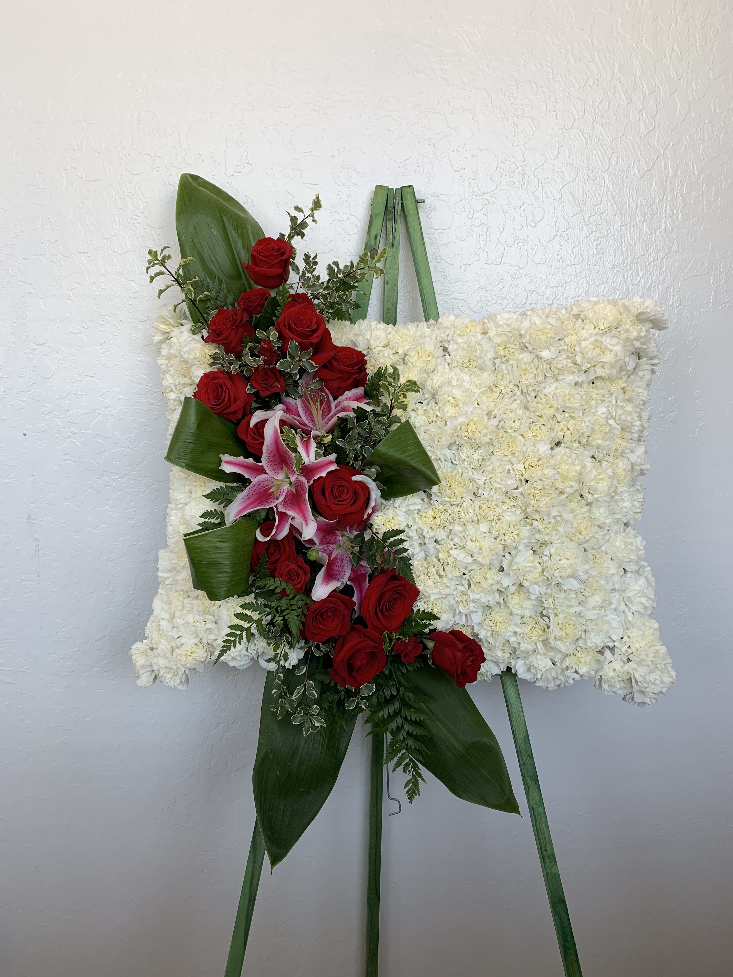 FP#01 Red Rose Floral Pillow - A floral pillow arrangement featuring carnations, roses, and stargazers.