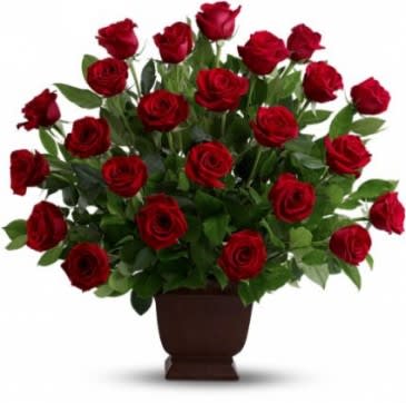 Tribute in Red Tribute in Red - Red Ecuadorian long-stem roses in a simple earthen urn create a simple, understated, but striking tribute.