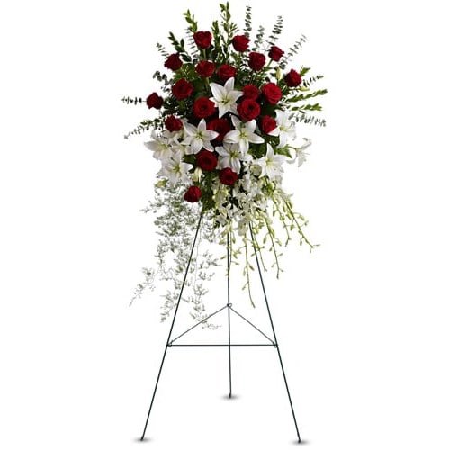 Lily and Rose Tribute Spray - Pure white lilies and dendrobium orchids mingle with red roses white asiatic lilies and more in this magnificent and impressive standing spray of the finest blooms. A fitting tribute for a funeral wake or memorial service. A standing spray of lush flowers such as red roses white dendrobium orchids and asiatic lilies - accented with greenery - is delivered on an easel.Approximately 31&quot; W x 50&quot; H Orientation: One-Sided As Shown : T226-1A