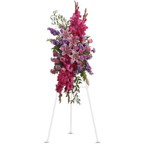 Touching Tribute Spray - Express admiration for her beauty and spirit with a striking tribute certain to evoke many cherished remembrances. Gorgeous flowers such as pink roses oriental lilies and gladioli blend with purple stock lavender carnations and fragrant greens.Approximately 22&quot; W x 56&quot; H Orientation: One-Sided As Shown : T234-1A