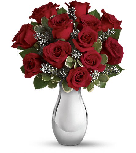 Loves Grace Loves Grace - One dozen ravishingly red roses showcased in a stunning silver reflections vase -. Classic and contemporary at the same time, it is a gift they'll love - with a dazzling keepsake vase they'll treasure. •The spectacular holiday bouquet features 12 red roses accented with assorted greenery.