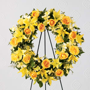 The FTD Ring of Friendship Wreath The FTD Ring of Friendship Wreath - The FTD® Ring of Friendship™ Wreath holds golden yellow roses Asiatic lilies and dendrobium orchids against a background of assorted greenery. An expression of your friendship and sympathies.