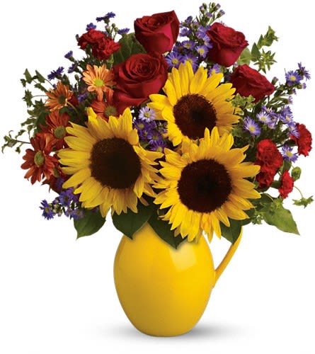 Teleflora's Sunny Day Pitcher of Joy Teleflora's Sunny Day Pitcher of Joy - Symbolizing warmth and happiness it is no wonder the sunflower is a quintessential ingredient in so many fall bouquets. This bouquet maximizes the joy of sunflowers by arranging them with a bevy of fall flowers it's a lovely pick-me-up for a crisp fall day. Sunny sunflowers red roses and miniature carnations bronze daisy spray chrysanthemums large lavender monte cassino asters and autumn greens are beautifully arranged in a ceramic pitcher.Approximately 17" W x 18 1/2" H Orientation: All-Around As Shown : TFL01-1ADeluxe : TFL01-1BPremium : TFL01-1C