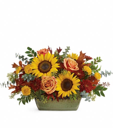 Teleflora's Sunflower Farm Centerpiece - Bursting with fall cheer, this radiant autumnal arrangement arrives in a hand-glazed, oven-to-table stoneware dish for years of baking and serving delight! 