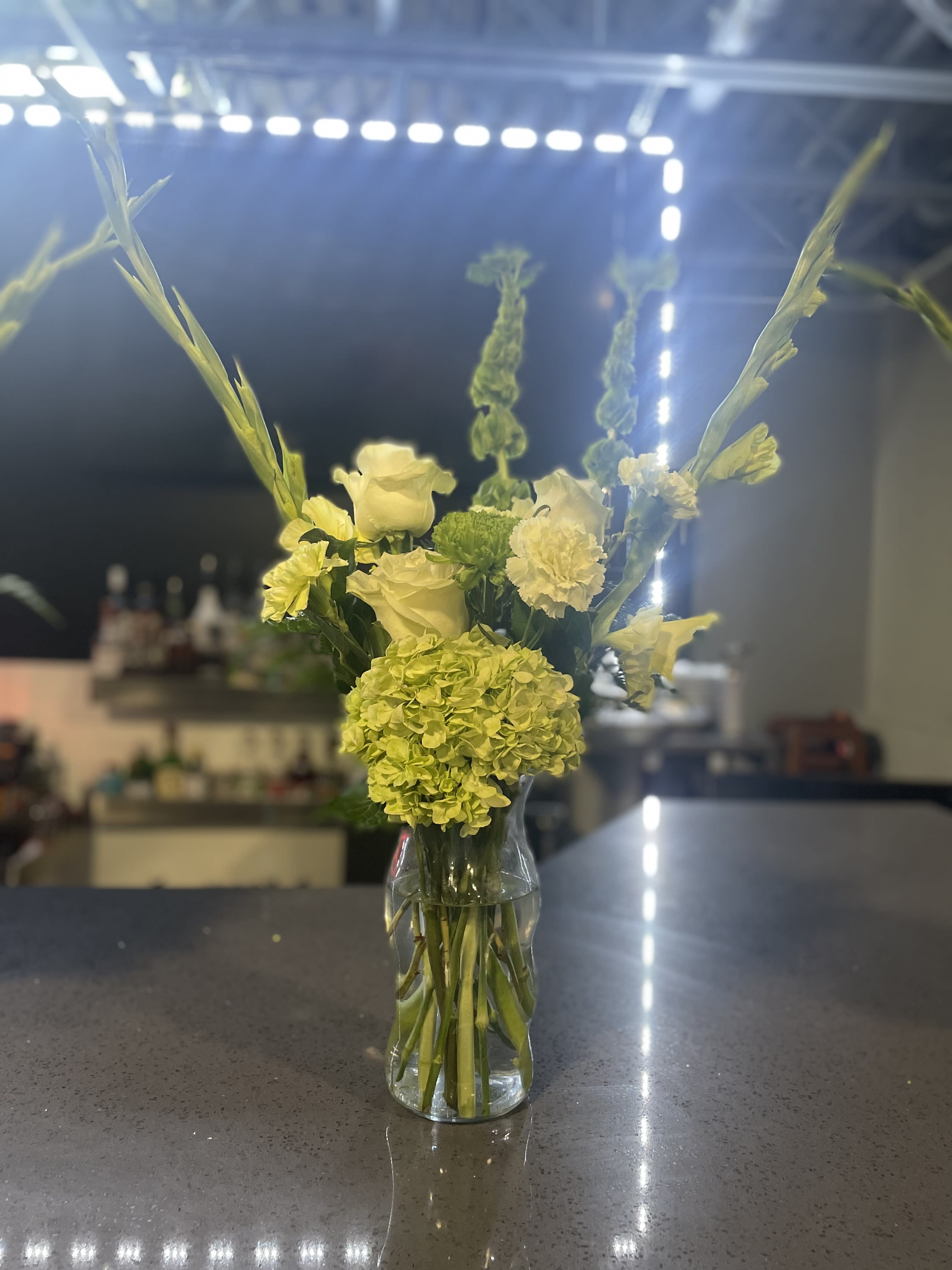 Green Delight  - A arrangement filled with green roses, hydrangeas, gladiolus and other green mixed flowers 