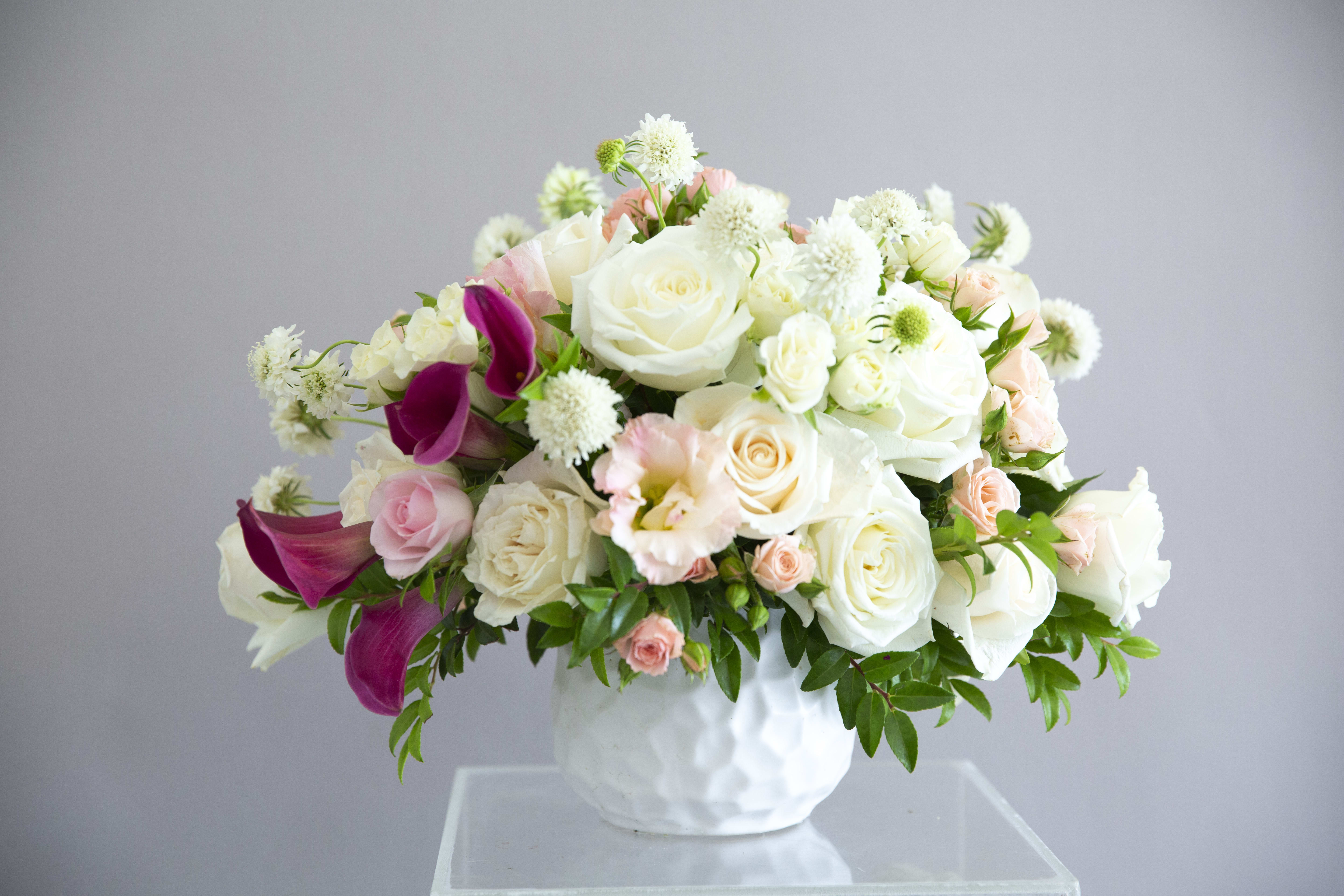 Devotion Devotion - An elegant design of cream and blush flowers, including roses, calla lily, and minimal greenery.