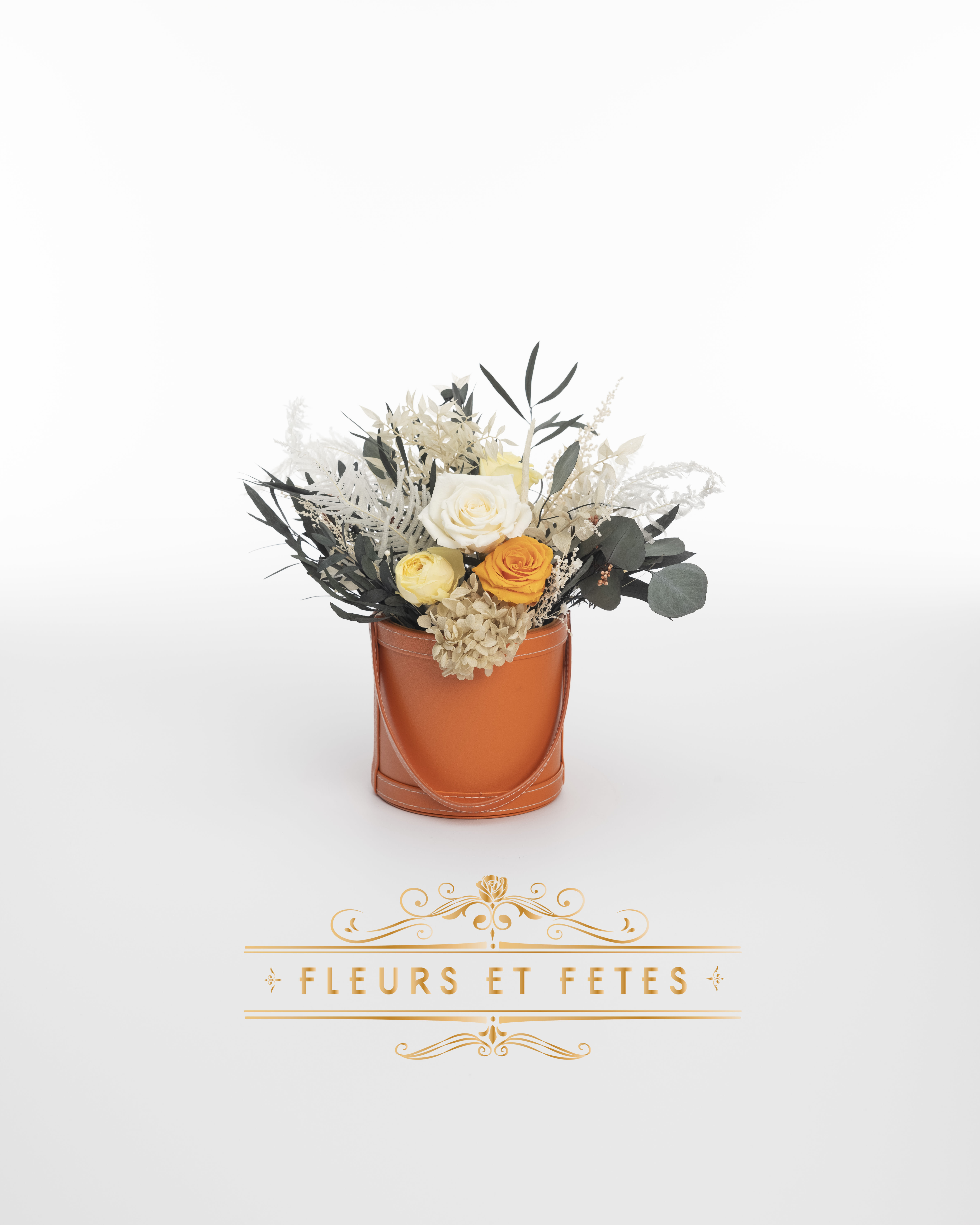 Small vegan leather box with mix garden flowers option 7 - This timeless arrangement is a part of our Everlasting Collection and features real roses, hydrangeas, and greens that last up to three years. Set in our hand-stitched vegan leather round box.   Our freshly picked Everlasting flowers have been chosen by expert farmers, and have gone through a technological process that enables them to become preserved. These flowers look and feel precisely like freshly cut flowers, but can last up to 3 years in the right conditions! Once our talented florists receive these flowers, they are arranged and designed inside a beautiful hand-stitched box. Everlasting flowers are the perfect choice for you to decorate your home or pamper your loved ones on special occasions.   Caring for Everlasting flowers:  1. Do not water the arrangement. 2. Keep the arrangement indoors. 3. Keep the arrangement out of direct sunlight. 4. Keep the arrangement in a cool, dry place. 5. Do not crush, press, or fold the petals.  **Please note that variations will occur since all of our arrangements are handmade by our in-house designers.** 
