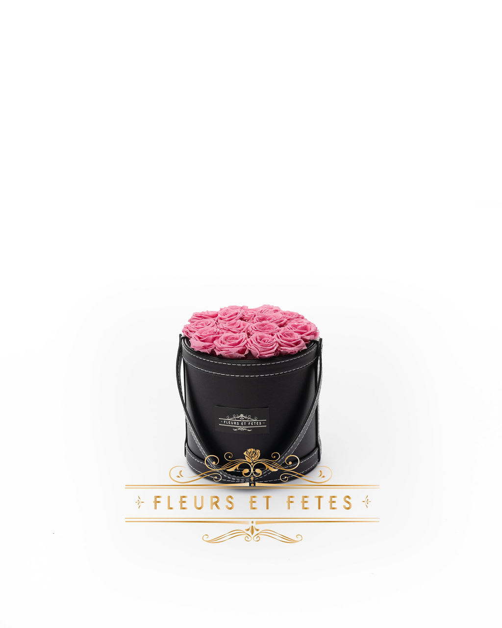 Small vegan leather box with hot pink roses - This timeless arrangement is a part of our Everlasting Collection and features real flowers that last up to one year. Set in our hand-stitched vegan leather round box.   **Please note that variations will occur since all of our arrangements are handmade by our in-house designers.**    Caring for Preserved Roses:  1. Do not water the arrangement 2. Keep the arrangement indoors 3. Keep the arrangement out of direct sunlight 4. Keep the arrangement in a cool, dry place 5. Do not crush, press, or fold the petals.