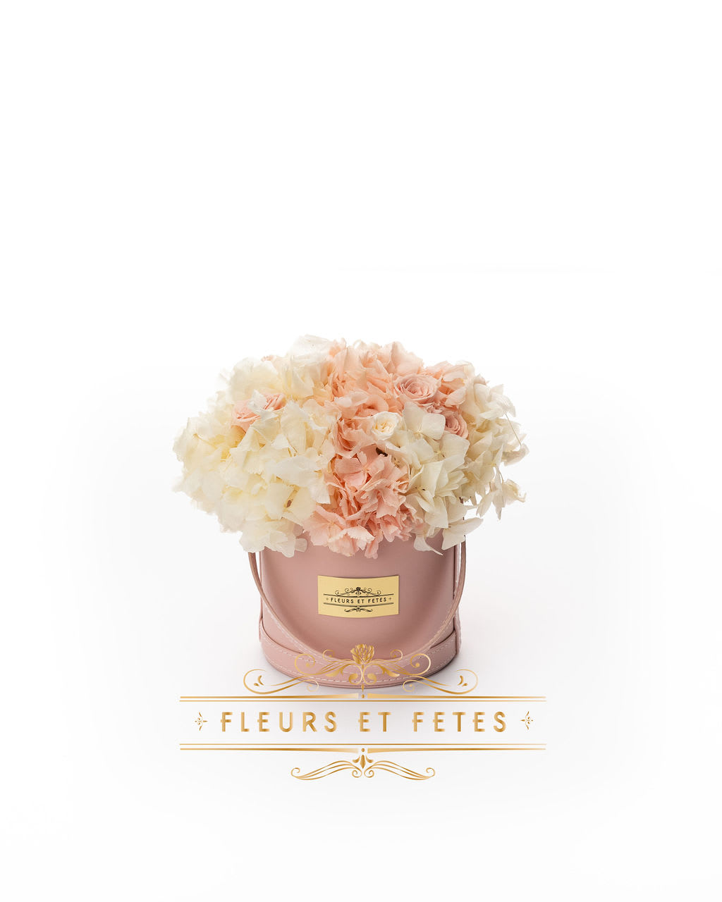 Small vegan leather box with mix flowers - This timeless arrangement is a part of our Everlasting Collection and features real roses and hydrangea that last up to three years. Set in our hand-stitched vegan leather round box.   Our freshly picked Everlasting flowers have been chosen by expert farmers, and have gone through a technological process that enables them to become preserved. These flowers look and feel precisely like freshly cut flowers, but can last up to 3 years in the right conditions! Once our talented florists receive these flowers, they are arranged and designed inside a beautiful hand-stitched box. Everlasting flowers are the perfect choice for you to decorate your home or pamper your loved ones on special occasions.   Caring for Everlasting flowers:  1. Do not water the arrangement. 2. Keep the arrangement indoors. 3. Keep the arrangement out of direct sunlight. 4. Keep the arrangement in a cool, dry place. 5. Do not crush, press, or fold the petals.  **Please note that variations will occur since all of our arrangements are handmade by our in-house designers.** 