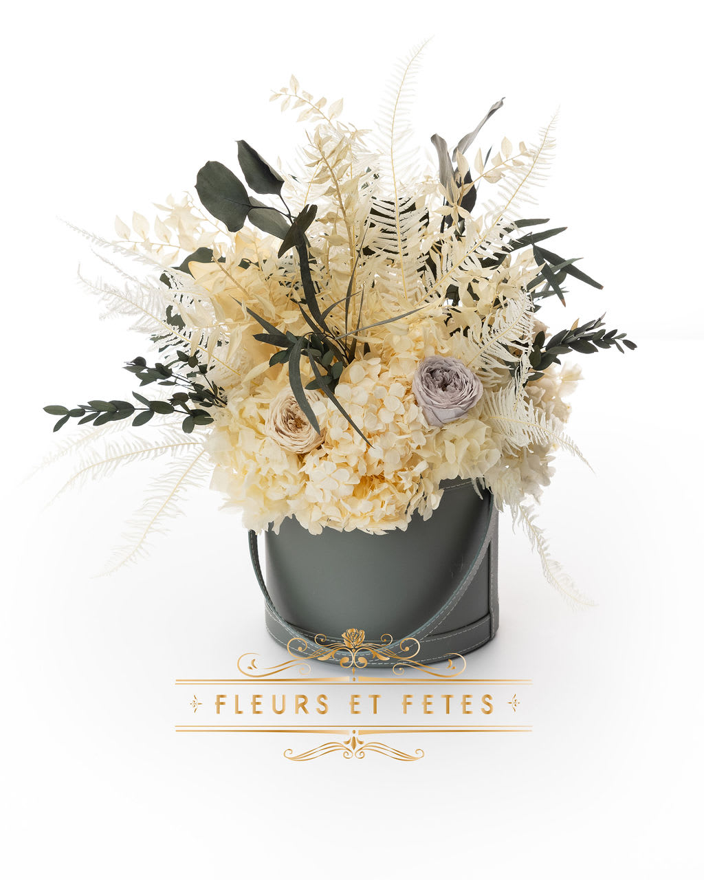 Medium vegan leather box with mixed garden flowers option 3 - This timeless arrangement is a part of our Everlasting Collection and features dry flowers and real flowers that last up to one year. Set in our hand-stitched vegan leather round box.    **Please note that variations will occur since all of our arrangements are handmade by our in-house designers.**    Caring for Preserved Roses:  1. Do not water the arrangement 2. Keep the arrangement indoors 3. Keep the arrangement out of direct sunlight 4. Keep the arrangement in a cool, dry place 5. Do not crush, press, or fold the petals.