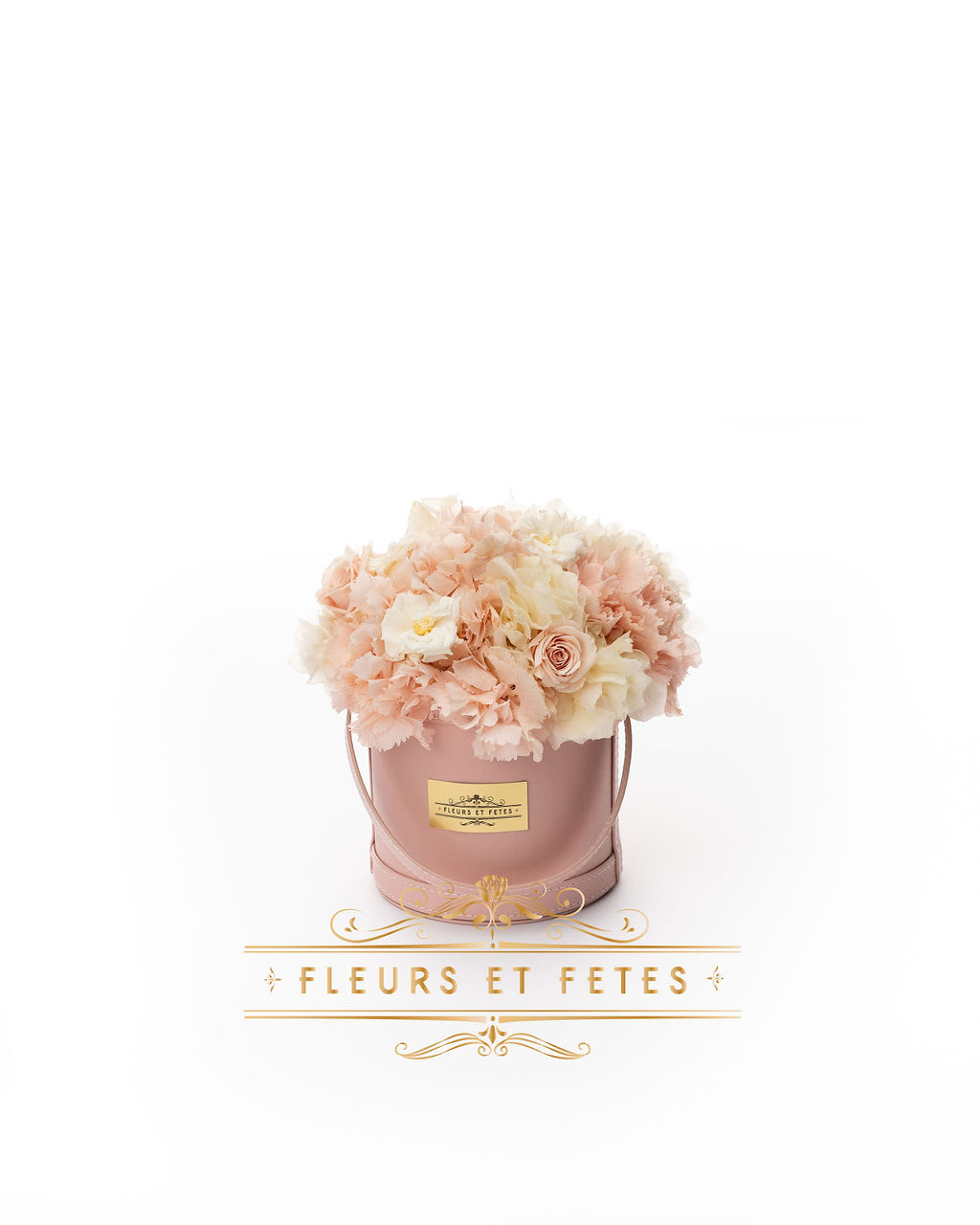 Small vegan leather box with mix flowers option 2 - This timeless arrangement is a part of our Eternity Collection and features real roses and hydrangea that last up to three years. Set in our hand-stitched vegan leather round box.   Our freshly picked Everlasting flowers have been chosen by expert farmers, and have gone through a technological process that enables them to become preserved. These flowers look and feel precisely like freshly cut flowers, but can last up to 3 years in the right conditions! Once our talented florists receive these flowers, they are arranged and designed inside a beautiful hand-stitched box. Everlasting flowers are the perfect choice for you to decorate your home or pamper your loved ones on special occasions.   Caring for Everlasting flowers:  1. Do not water the arrangement. 2. Keep the arrangement indoors. 3. Keep the arrangement out of direct sunlight. 4. Keep the arrangement in a cool, dry place. 5. Do not crush, press, or fold the petals.  **Please note that variations will occur since all of our arrangements are handmade by our in-house designers.**  