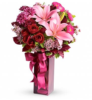 True Loves Wish - A dramatic arrangement of deep red, purple and magenta hues, it's the perfect choice for a date night out, to say I'm sorry, or just because. Its tall plum-colored keepsake vase arrives filled with water, and flowers are ready to be immediately enjoyed upon delivery. L'amour! 