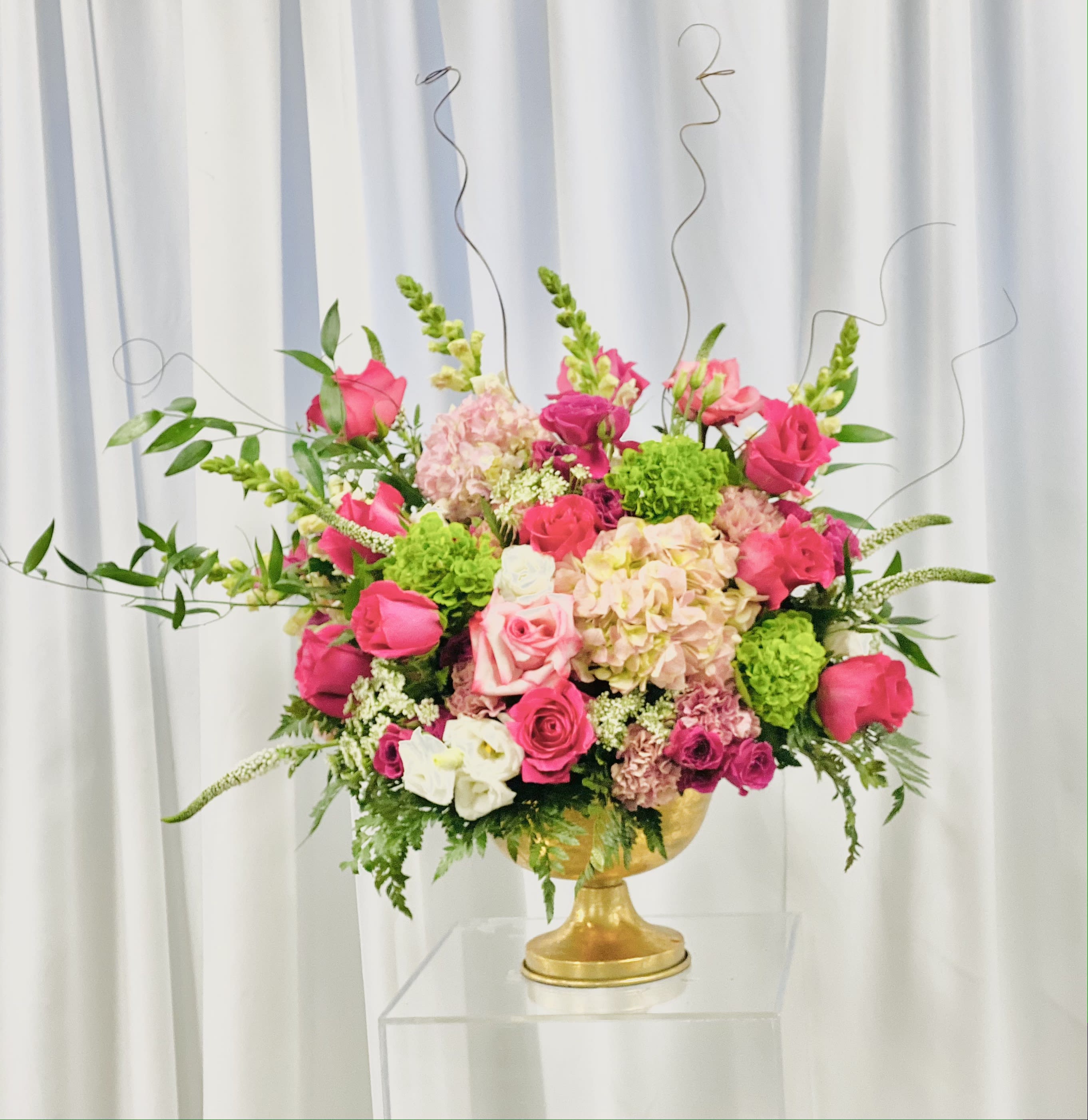 Sophisticated Lady - Gorgeous display of hot pink and light pink flowers - roses, hydrangea, spray roses, mums, carnations, greenery placed in bejeweled vase showcasing nothing but sophistication.    *Please view policy section regarding substitutions.