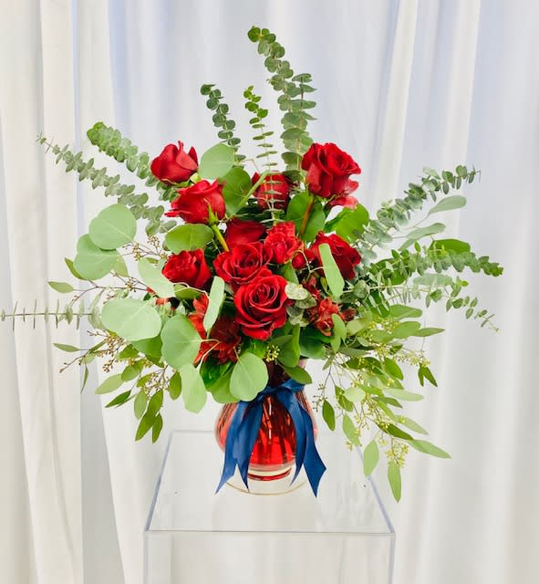 Pure Romance Pure Romance - Bouquet full of red roses, alstroemeria, and spray roses accented with eucalyptus. This design is for pure romance.