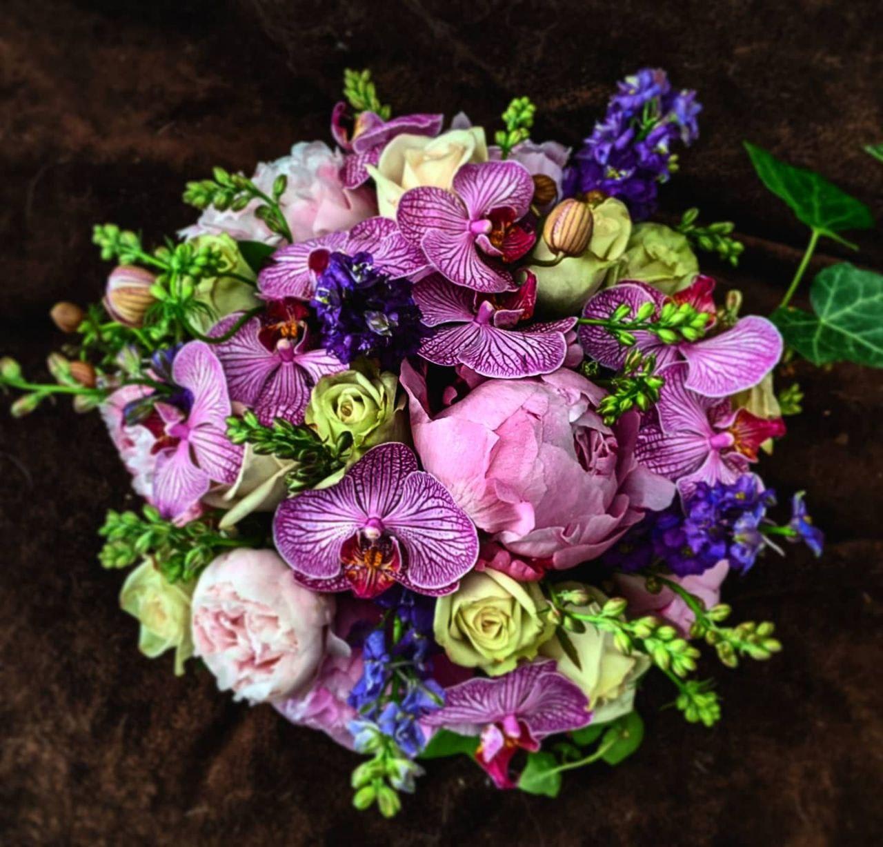 Blush peonies with exotic orchids in New York, NY | Garage Flowers