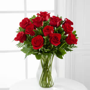 The FTD® Blooming Masterpiece Rose Bouquet The FTD® Blooming Masterpiece Rose Bouquet - The FTD® Blooming Masterpiece™ Rose Bouquet is a classic expression of love and sweet affection! A bouquet of red roses arrive accented with lush greens, all beautifully arranged in a clear glass vase.