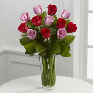 The FTD® Red and Lavender Rose Bouquet The FTD® Red and Lavender Rose Bouquet - The FTD® Red and Lavender Rose Bouquet beautifully expresses your love with its gorgeous combination of color and elegance. Rich red roses mingle with lavender roses accented with vibrant greens, all arranged in a clear glass vase to make a lasting impression on your sweetheart this Valentine's Day.