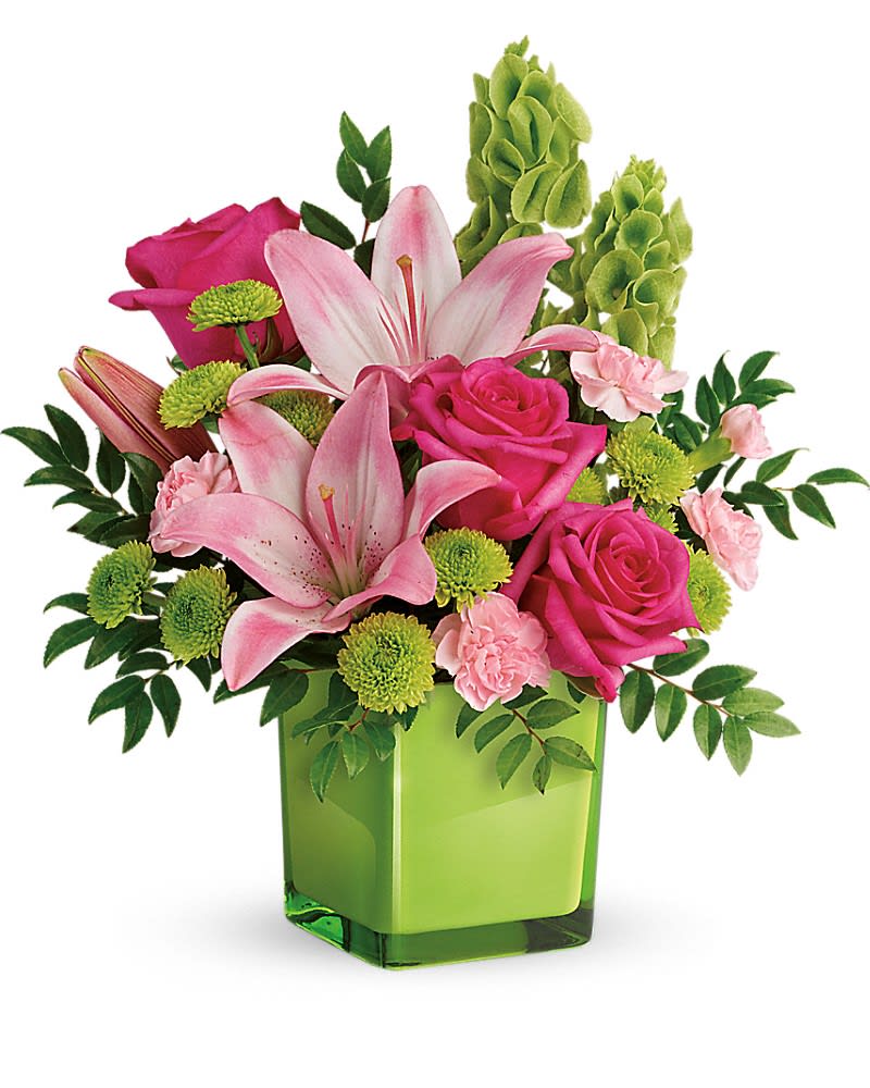 In Love With Lime Bouquet In Love With Lime Bouquet - Lime-a-licious! Fresh shades of green are a great way to contrast pink roses and lilies. Hand-delivered in a lovely leaf green cube, it's a loving gift any day of the week! This refreshing arrangement features dark pink roses, pink asiatic lilies, pink miniature carnations, bells of ireland, green button spray chrysanthemums, and huckleberry. Delivered in a glass cube.Approximately 14" W x 15" H
