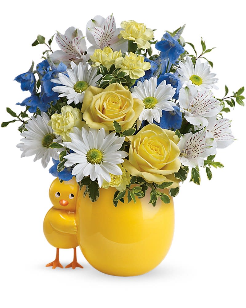 Sweet Peep Bouquet - Baby Blue - A little one has arrived! Welcome them home with a lush bouquet of yellow roses and blue delphinium, beautifully arranged in this adorably cheerful chicky vase. The new parents will love to display the sweet ceramic keepsake in the nursery! Surprise them with this bouquet of stunning yellow roses, white alstroemeria, miniature light yellow carnations, light blue delphinium, white daisy spray chrysanthemums, pitta negra and lemon leaf. Delivered in a Happy Chick keepsake.