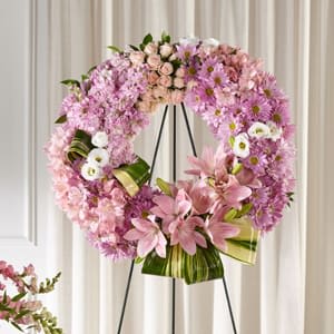 The FTD® Gift of Warmth™ Wreath - When someone you know is going through a difficult time, our Gift of Warmth™ Wreath shares your support. An array of pink and lavender blooms in a classic shape is thoughtfully crafted by a local florist to express your sympathy. - Details: o Wreath is approximately 25&quot; in diameter