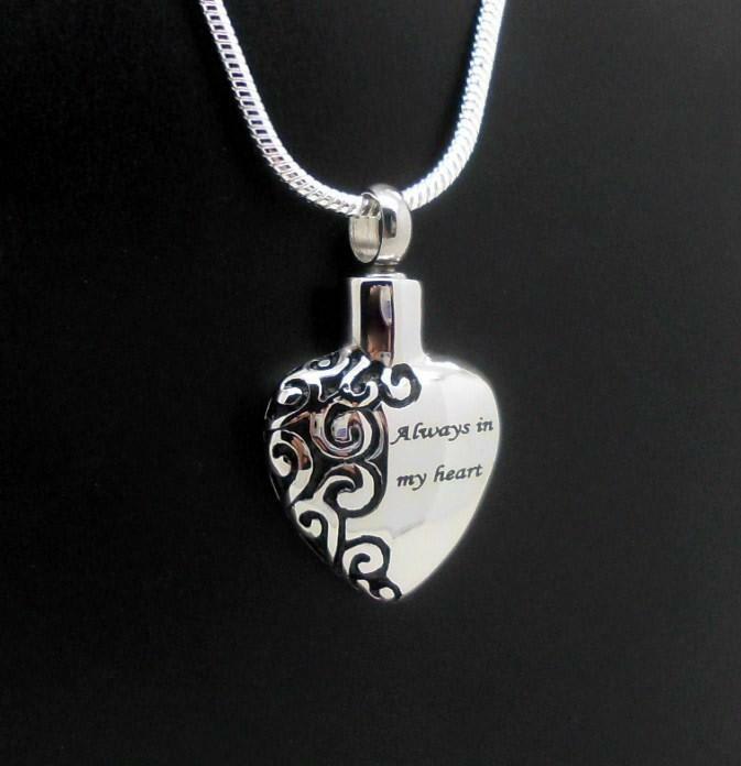 Always In My Heart Stainless Steel Urn Heart Pendant Always In My Heart Stainless Steel Urn Heart Pendant - Simple, yet elegant. High quality stainless steel cremation urn pendant. Threaded at top, holds a very small amount. Supplied with a 22″ chain and double stitched microfiber jewelry pouch. Dimensions: 1 1/4″ L x 3/4″ W x 1/