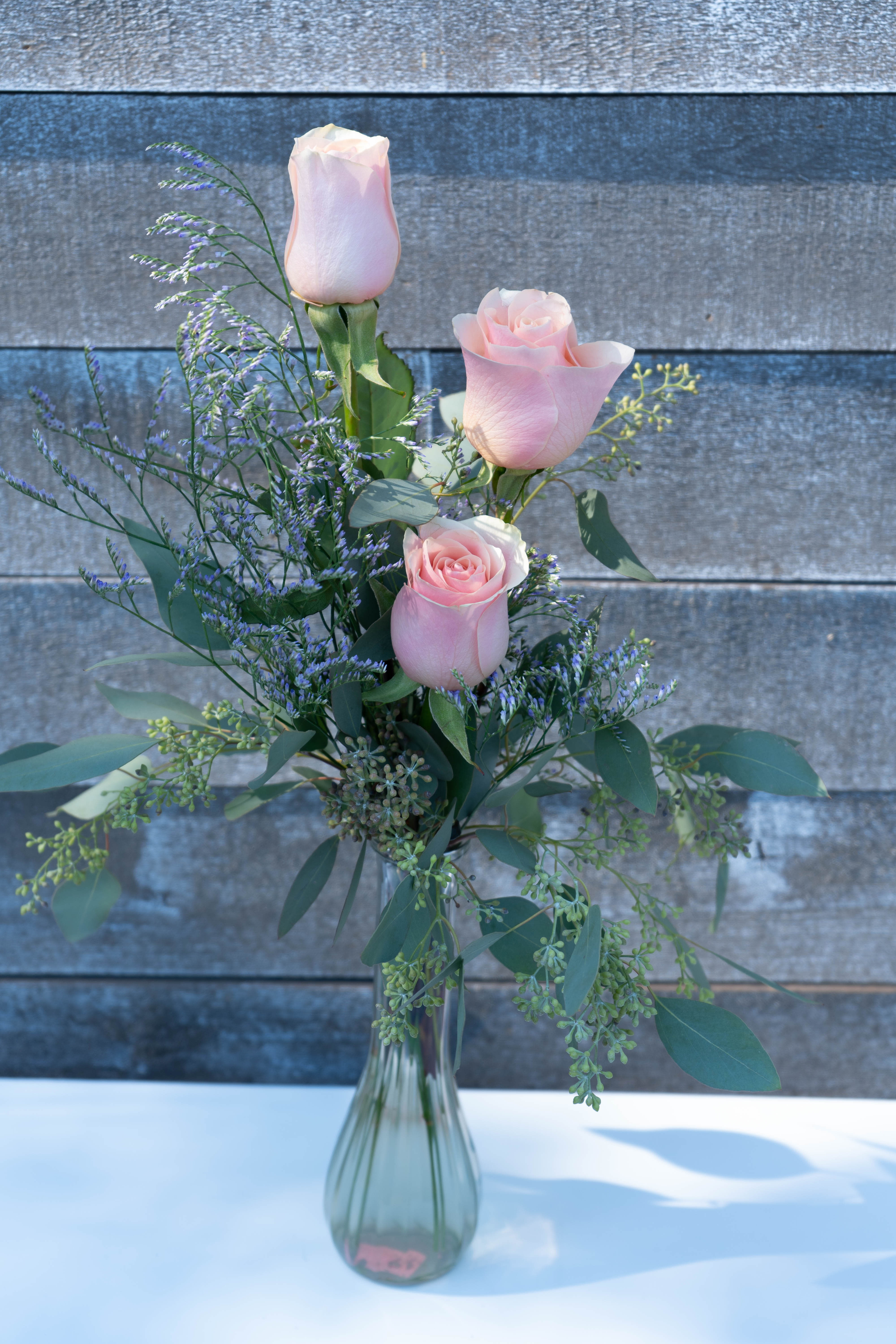 3 blush rose bud vase - Classic gorgeous blush Ecuadorian roses complimented with Greenery and light filler. Perfect gift for anyone!
