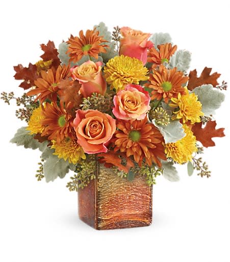 Teleflora's Grateful Golden Bouquet Teleflora's Grateful Golden Bouquet - Two fabulous fall gifts in one, this lovely autumnal bouquet is hand-arranged in an opalescent mercury glass cube with golden ombre finish.