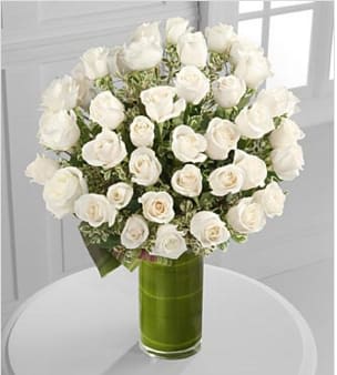 Clarity Luxury Rose Bouquet Clarity Luxury Rose Bouquet - The love you share is clear in your heart. The classic elegance and peaceful purity of our 24-inch premium long-stemmed white roses are delightfully elegant and sophisticated situated in a superior modern 10-inch clear glass cylindrical vase to create a dazzling display of limitless love and affection. Includes: 48 stems of 24-inch premium long-stemmed white roses, exotic foliage and a superior 10-inch clear glass cylindrical vase. Approx. 26H x 23W Your purchase includes a complimentary personalized gift message.