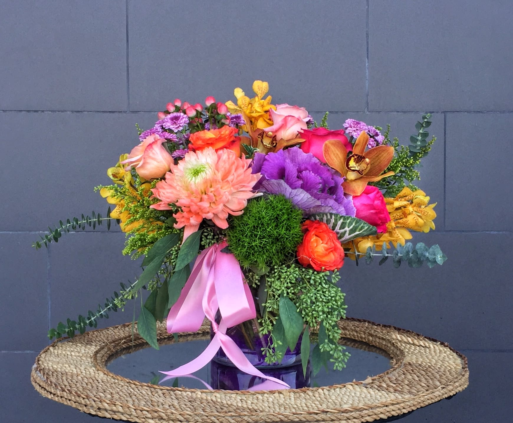 Chic Blooms - Lovely design including all premium fresh flowers: orchid, rose, lily... and accents in a nice vase. STANDARD: FIRST PHOTO DELUXE: SECOND PHOTO