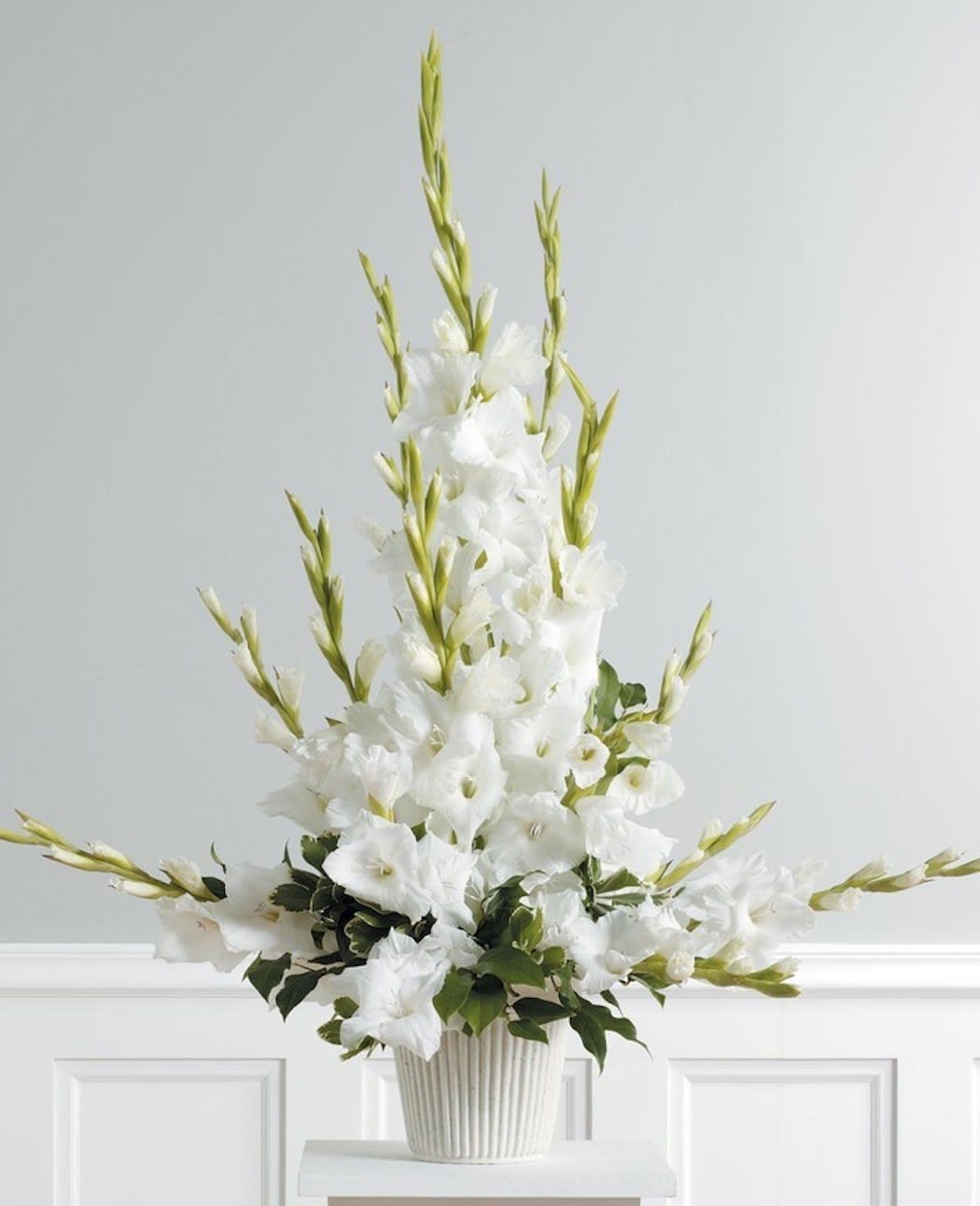 Gladiolus Essence - Urn spray filled with the beauty of gladiolus. Color options may be available. A towering display of select White Gladiolus offer a memorable funeral service or home offering