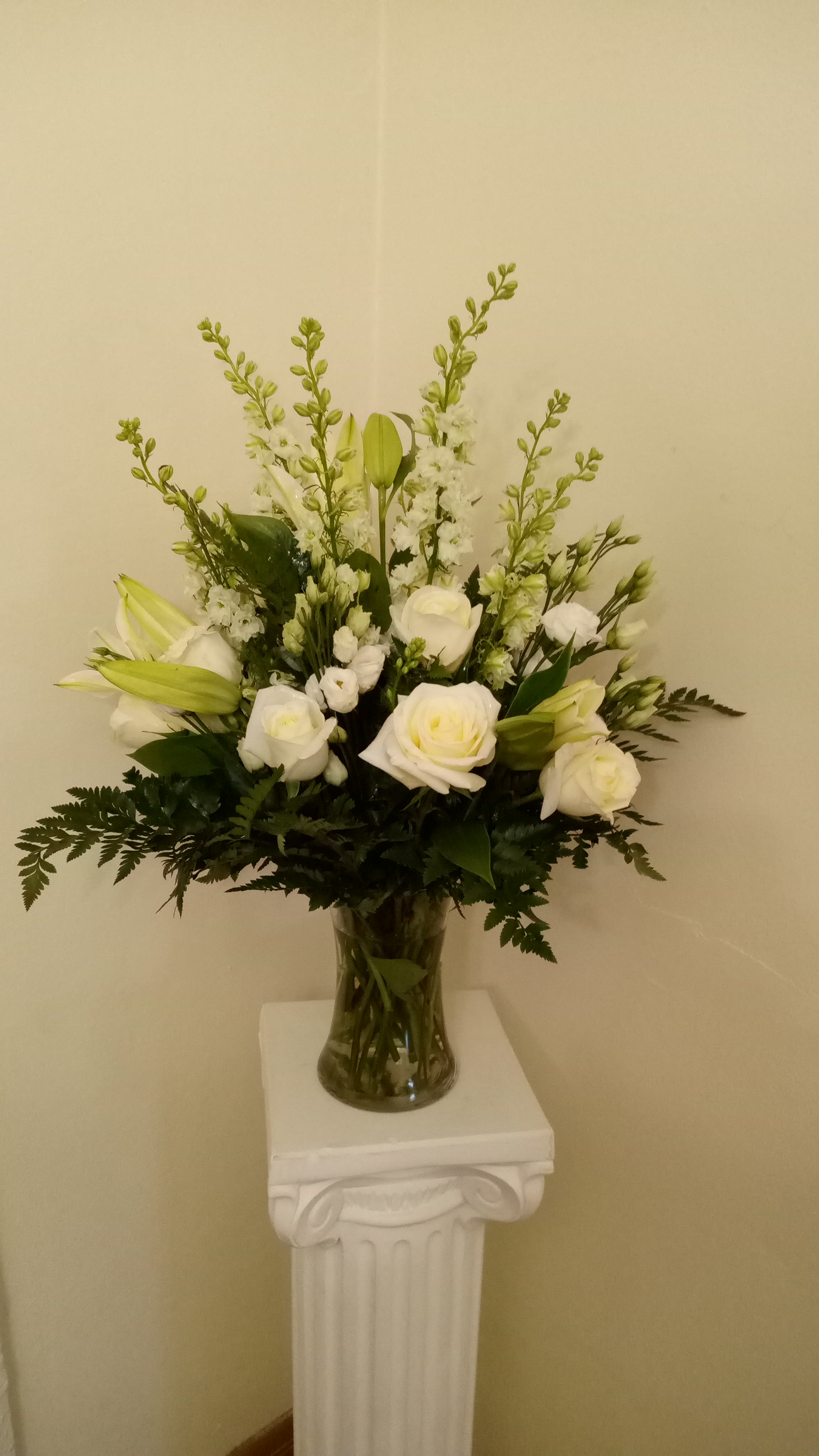 A Touch of Peace - White roses, snapdragons, lily, and much more