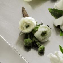FTD White Ranunculus Boutonniere - The FTDÂ® White Ranunculus Boutonniere gives a modern twist to the look   of the groom and groomsmen on the wedding day. A single stem of white   ranunculus boasting 2 to 3 blooms and additional buds has a textured   appeal that adds interest and soft sophistication to any wedding style.   Approx. 5âH x 3âW. 
