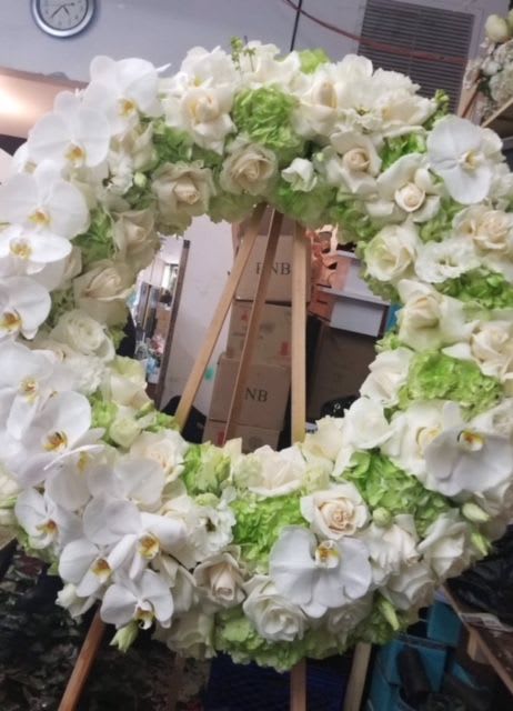 Standing Spray Heart 1 - A heart shaped standing spray filled with roses, hydrangeas, phale orchids, and dendrobium orchids. 
