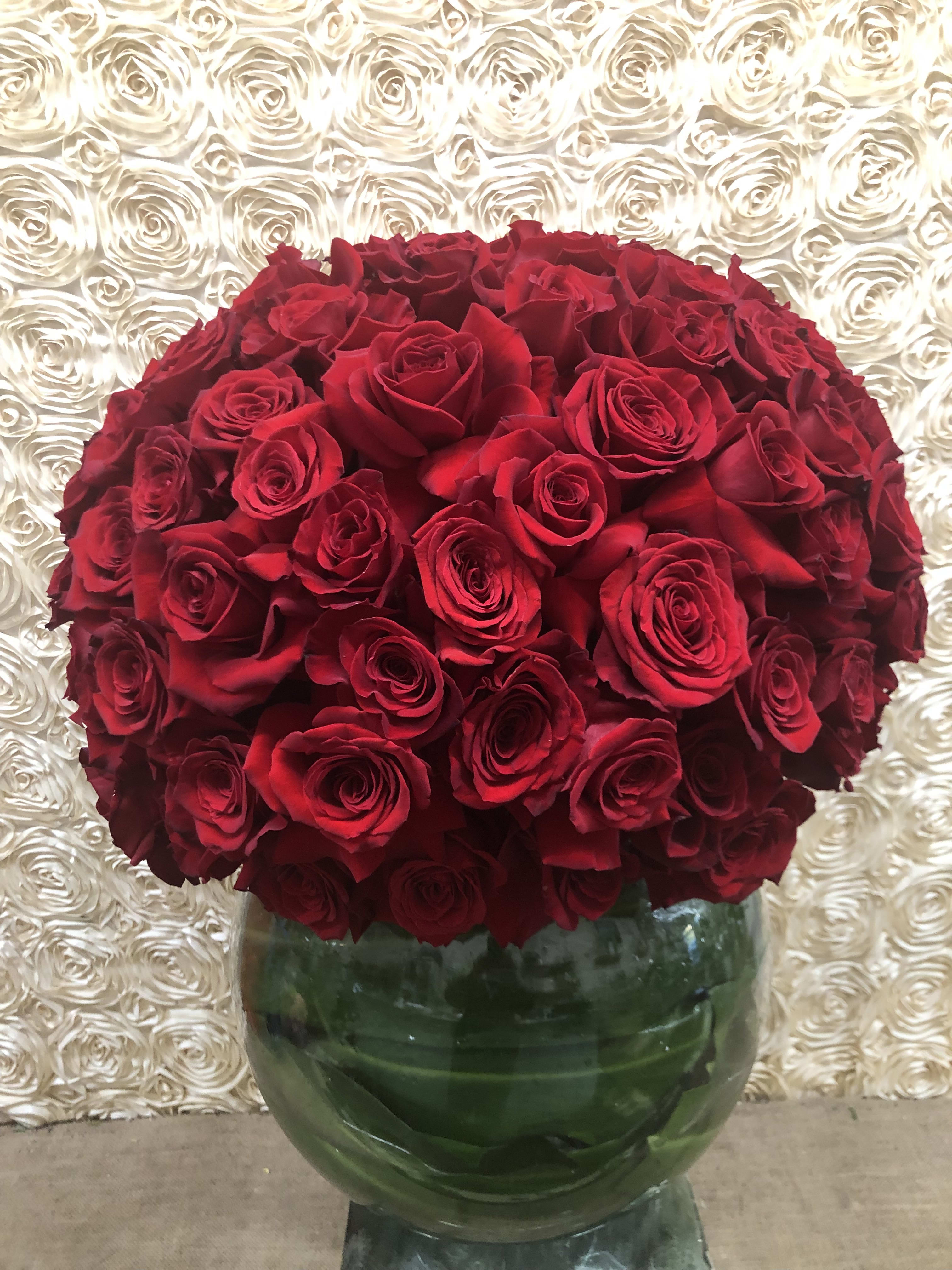Love Will Conquer All - A stunning arrangement filled to the brim with gorgeous red roses. 