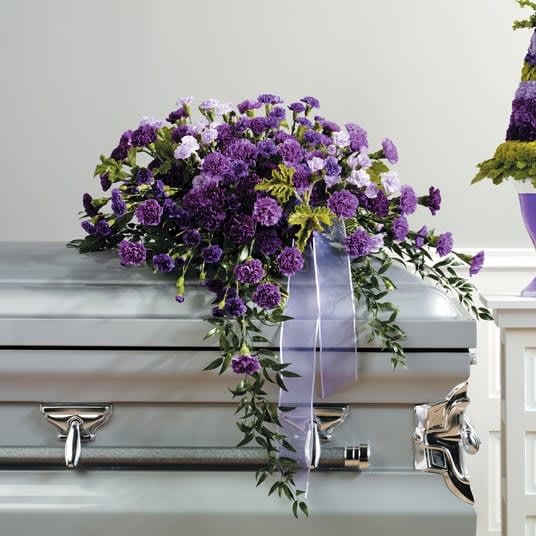 Purple Carnation Casket Spray - A casket spray of carnations in soothing purple and lavender shades brings peace and beauty to the service.