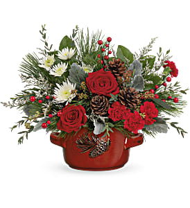 VINTAGE STONEWARE CENTERPIECE - Serve up holiday cheer with a festive Christmas rose bouquet, bursting from this vintage stoneware serving dish! It's hand-painted and food-safe for years of holiday entertaining.  Red roses, miniature red carnations, white cushion spray chrysanthemums and white limonium are arranged with dusty miller, white pine, parvifolia eucalyptus, seeded eucalyptus and lemon leaf. Delivered in Teleflora's Vintage Stoneware Bowl. Approximately 16 1/2&quot; W x 12 1/2&quot; H