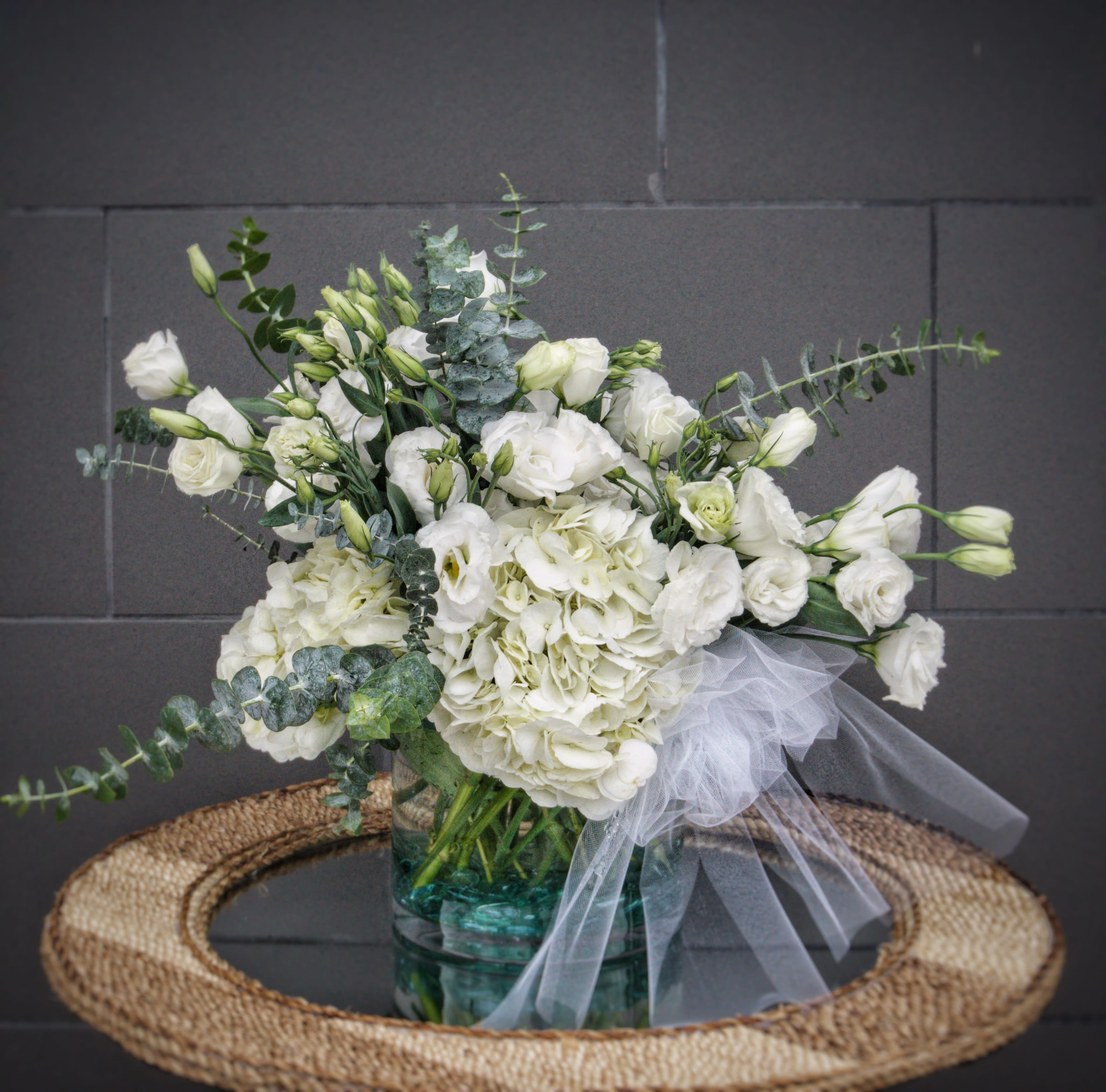 Mute Swan - Beautiful and elegant like a Mute Swan, this design includes soft lisianthus, hydrangea and accents in a nice glass vase.