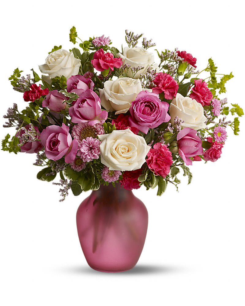 Rose Medley - Standard - 16 &quot; H x 14 1/2&quot; W (5 roses, 2 spray roses) Deluxe - 16&quot; H x 14 1/2&quot; W (6 roses, 3 spray roses, additional carns &amp; asters) Premium - 16&quot; H x 14 1/2&quot; W (7 roses, 4 spray roses, additional carns &amp; asters)  Does someone you know love roses? Then they'll love this lush fresh pink medley of blossoms mixed with a generous helping of fragrant roses. Delivered in a glass sweetheart vase it's a pleasing bouquet that's perfect for a birthday anniversary or any day of the year. Roses and spray roses are mixed with fresh flowers such as miniature carnations and Matsumoto asters - in shades of white and pink - and delivered in a glass vase.