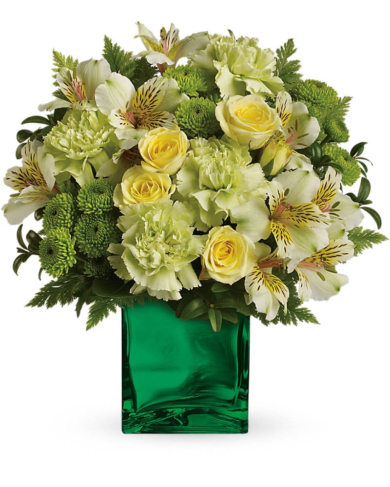 Teleflora's Emerald Elegance Bouquet - Standard - 12&quot; H x 12 1/2&quot; W Deluxe - 12 1/2&quot; H x 13 1/2&quot; W Premium - 13&quot; H x 14 1/2&quot; W  Like a breath of fresh air this crisp spring bouquet delivers a burst of citrus style to your lucky someone. This unique blend of yellow and green blooms in a shimmering emerald glass cube is simply brilliant! Includes yellow roses alstroemeria green carnations and button spray chrysanthemums accented with oregonia and leatherleaf fern. Delivered in a Mirrored Cube.