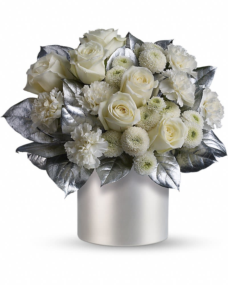 Teleflora's Elegant Evening Teleflora's Elegant Evening - When the occasion requires elegance, you need look no further than this fabulous bouquet that's all dressed up in winter whites and silver. Stunning white roses, carnations and chrysanthemums are exquisitely arranged with silver painted salal stems in a silvery, satiny cylinder vase. The evening and the arrangement will be ones to remember!