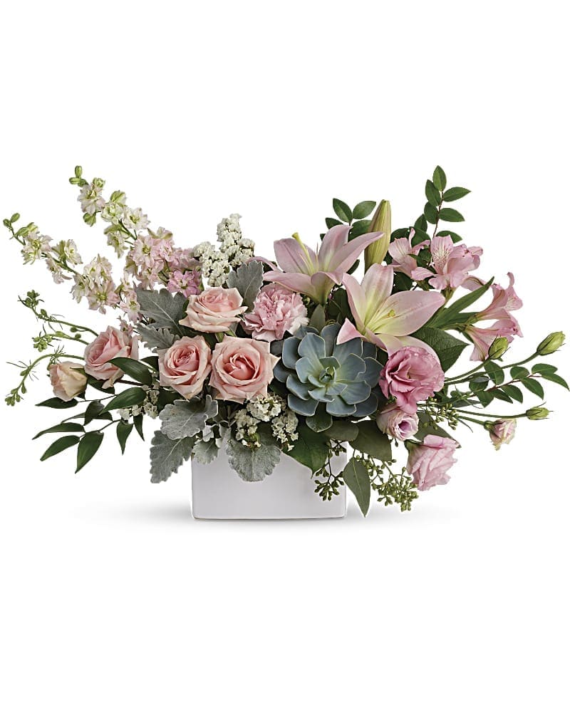 Hello Beautiful Bouquet Hello Beautiful Bouquet - Take their breath away with the beautiful hello that this bouquet brings! A wildly sophisticated array of pale pink roses and lilies with modern greens, it's perfectly presented in a simple white square vase. This feminine bouquet includes light pink spray roses, light pink asiatic lilies, pink alstroemeria, pink carnations, pink larkspur, white sinuata statice, dusty miller, israeli ruscus, huckleberry, seeded eucalyptus, lemon leaf, and a large green potted echeveria succulent. Delivered in a white square vase.