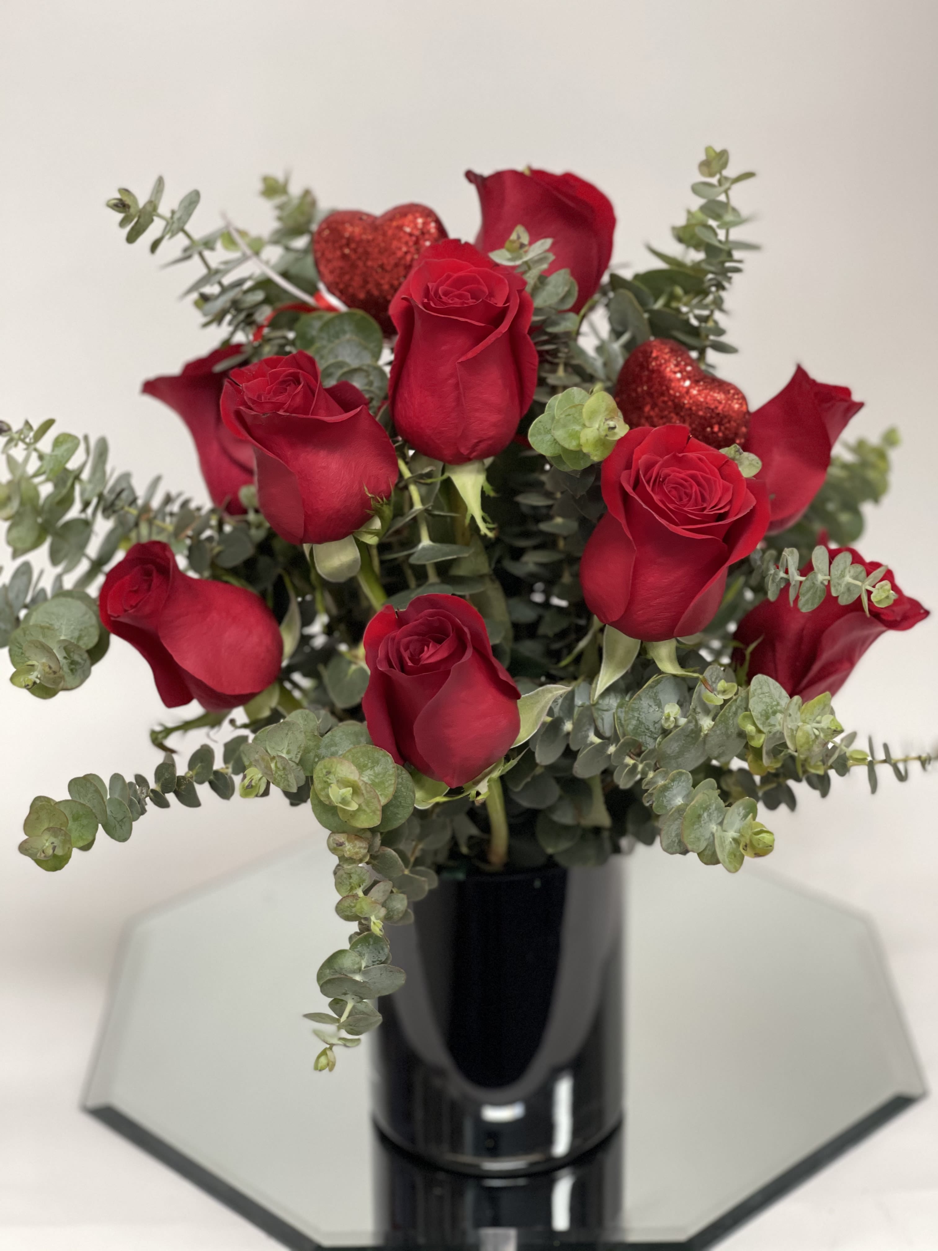 4’ black vase w/ red roses - Red Roses and Baby eucalyptus all around centerpiece 