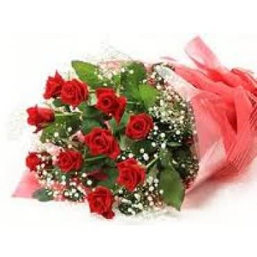 One Dozen Long Stem Red Roses Wrapped One Dozen Long Stem Red Roses Wrapped - We select the freshest and longest roses and surround them with greenery and filler. The wrapped presentation bouquet is secured with "arrive alive" wrapping which keeps the stems hydrated for at least 6-10 hours. Our professional delivery personnel will hand deliver this bouquet to the love of your life.