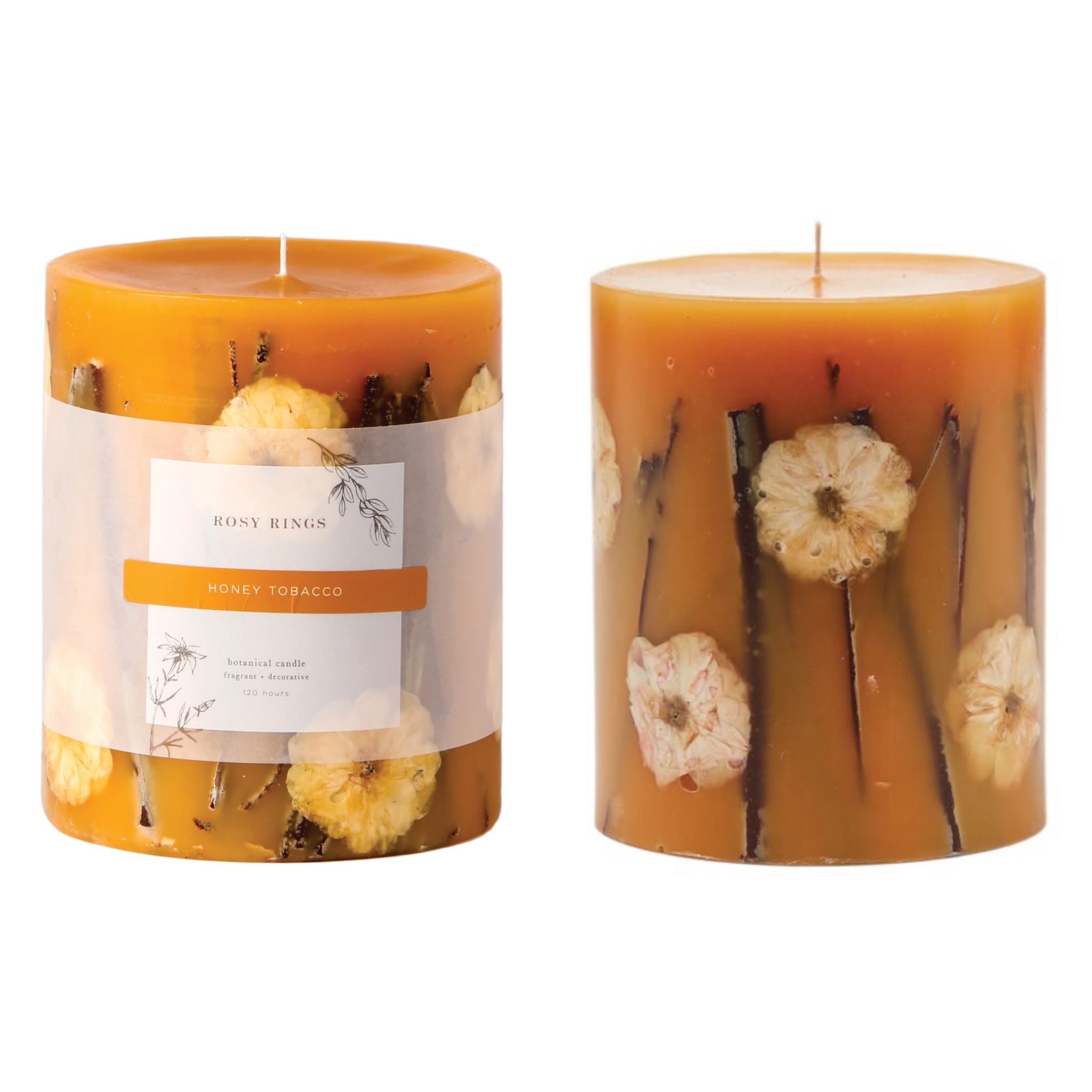 Rosy Rings Honey Tobacco Botanical Candle - Leather-bound books, antique wood, pipe tobacco paired with a golden drizzle of vanilla infused honey. 120 hours approx. burn time. A fragranced wax core is wrapped in a flame retardant barrier and then placed in a larger mold. A skilled artisan then carefully places the natural items around the core and hand pours a proprietary blend of wax into the mold. Each botanical work of art takes two days to produce. The botanicals are beautifully illuminated when the candle is lit. Rosy Rings is internationally recognized as the preeminent botanical candle manufacturer.